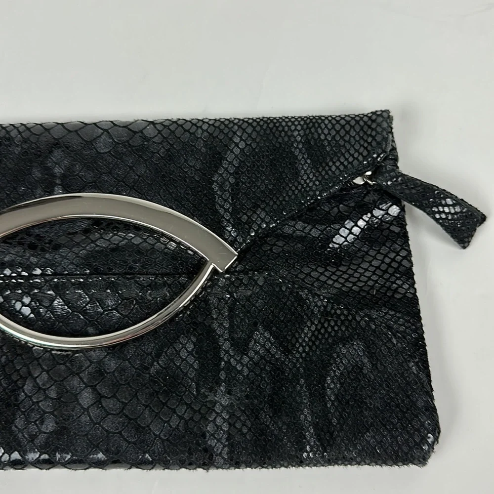 Bebe faux snake skin clutch with silver hardware
